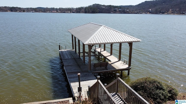 view of dock featuring a water view and boat lift