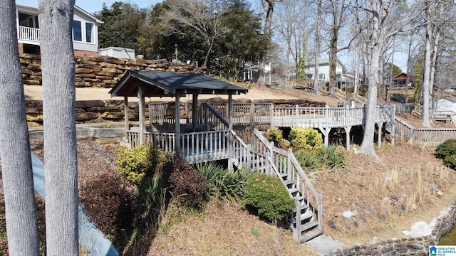 exterior space featuring stairs and a deck