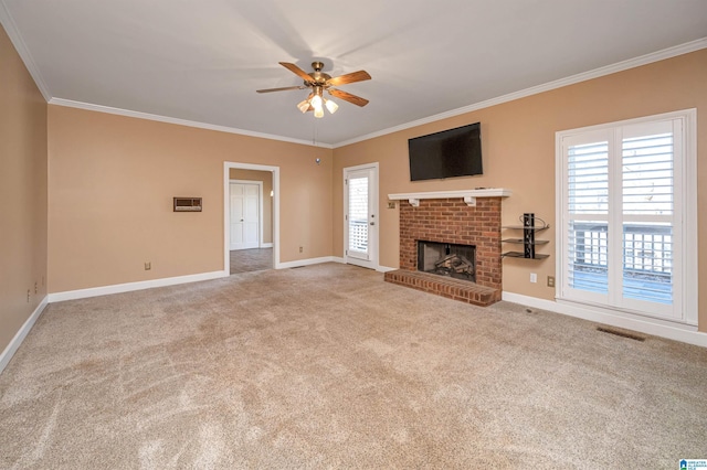 unfurnished living room featuring carpet, a fireplace, crown molding, baseboards, and ceiling fan