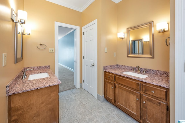 full bath with crown molding, two vanities, and a sink