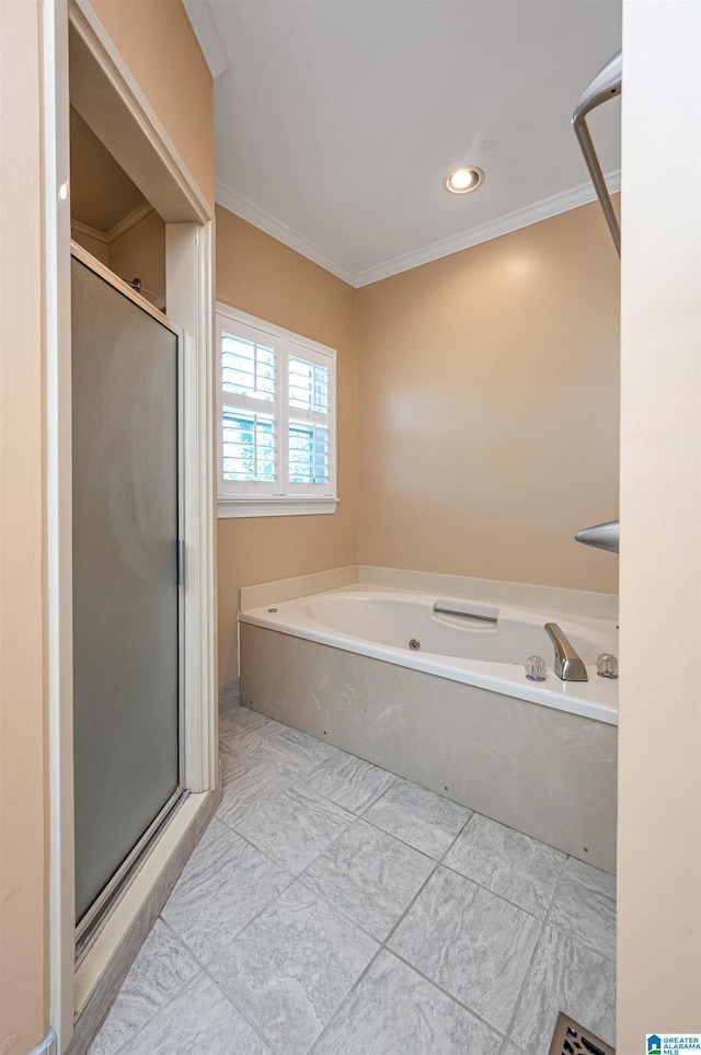 bathroom featuring a shower stall, a garden tub, and crown molding