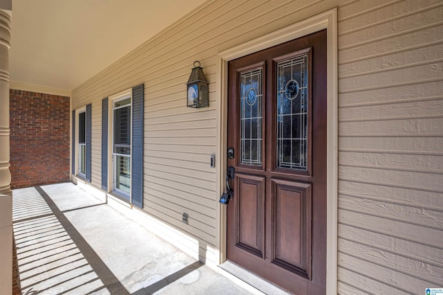 doorway to property with covered porch