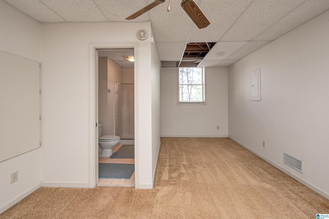 unfurnished bedroom with visible vents, ensuite bath, a paneled ceiling, and carpet floors