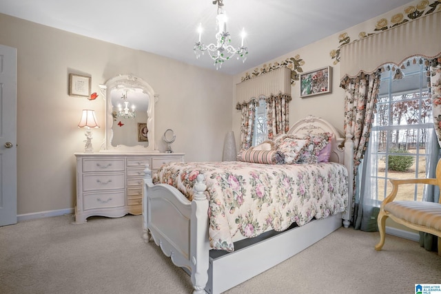 bedroom with an inviting chandelier, light colored carpet, and baseboards