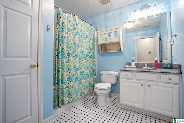 bathroom with vanity, curtained shower, toilet, and visible vents