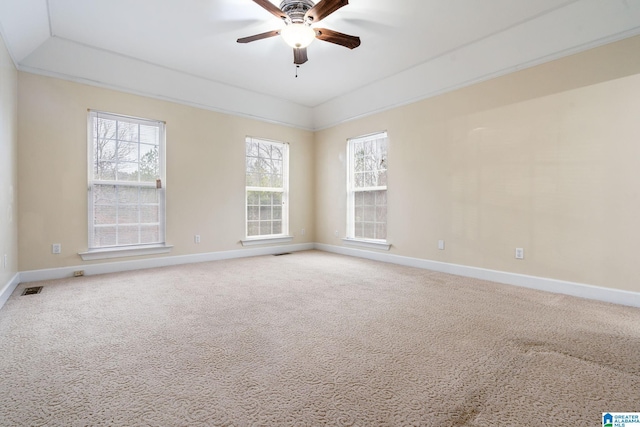 unfurnished room with carpet flooring, visible vents, baseboards, and ceiling fan