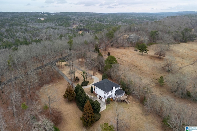 drone / aerial view with a rural view and a view of trees