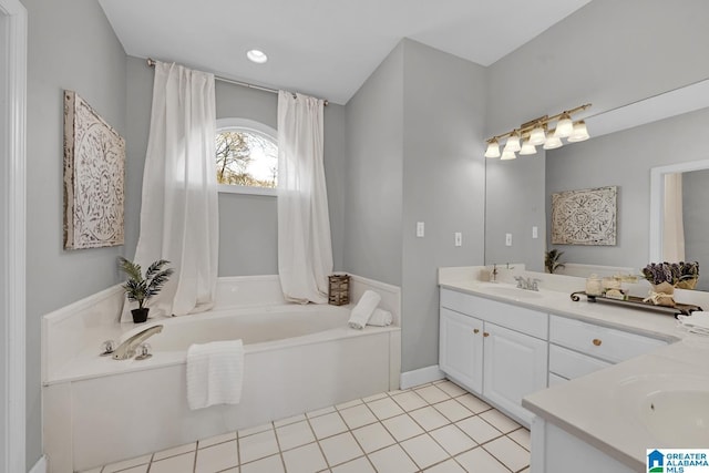 full bath featuring vanity, a garden tub, recessed lighting, and tile patterned flooring