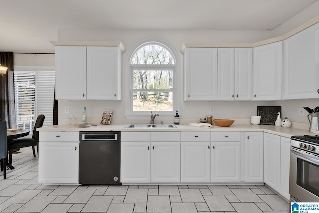 kitchen featuring a sink, light countertops, white cabinetry, and stainless steel appliances