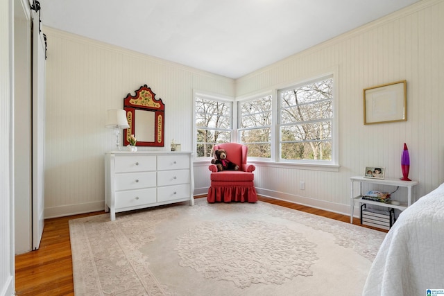 bedroom with wood finished floors and baseboards