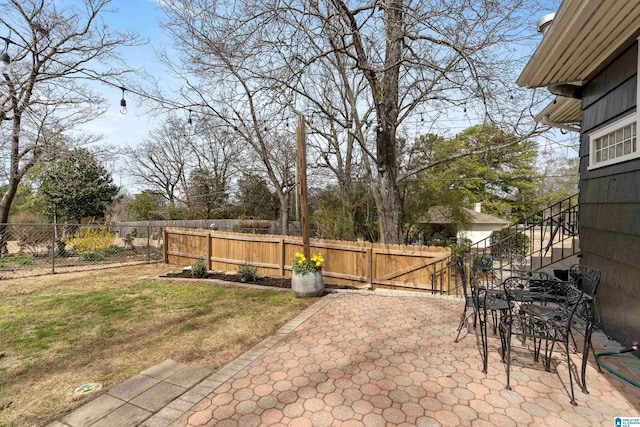 view of patio / terrace with a fenced backyard and outdoor dining space