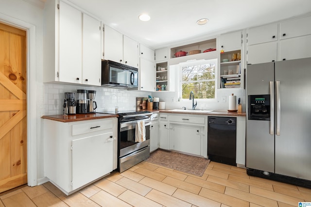 kitchen with black appliances, a sink, open shelves, white cabinetry, and decorative backsplash