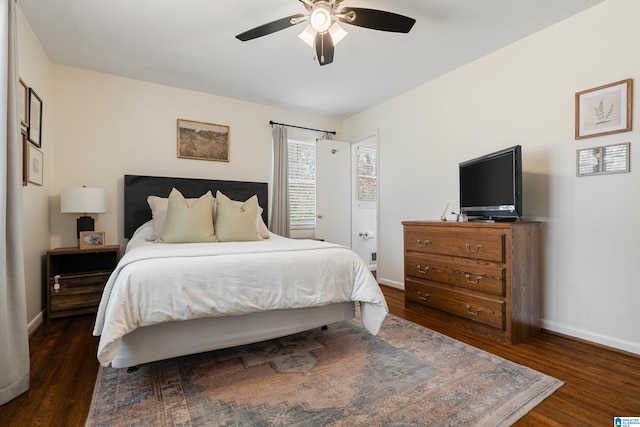 bedroom featuring ceiling fan, baseboards, and dark wood-style floors