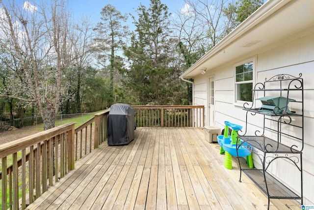 wooden terrace featuring area for grilling