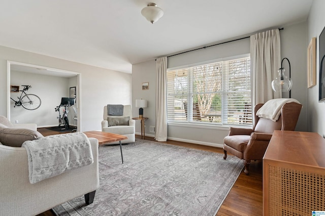 living area featuring wood finished floors and baseboards