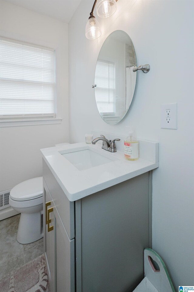 bathroom featuring vanity and toilet