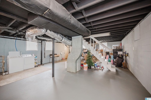 basement featuring washer and dryer and stairs