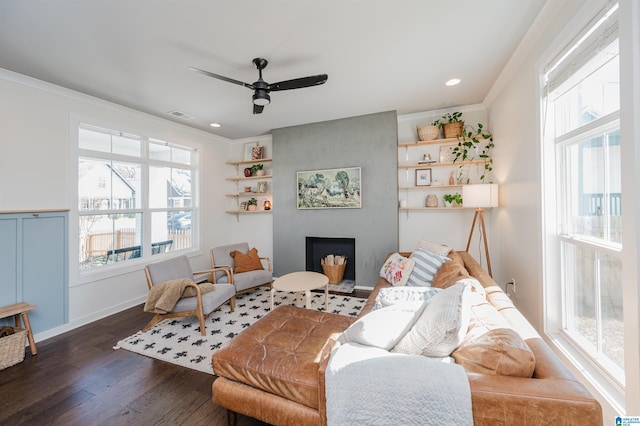 living area featuring visible vents, crown molding, ceiling fan, recessed lighting, and wood finished floors