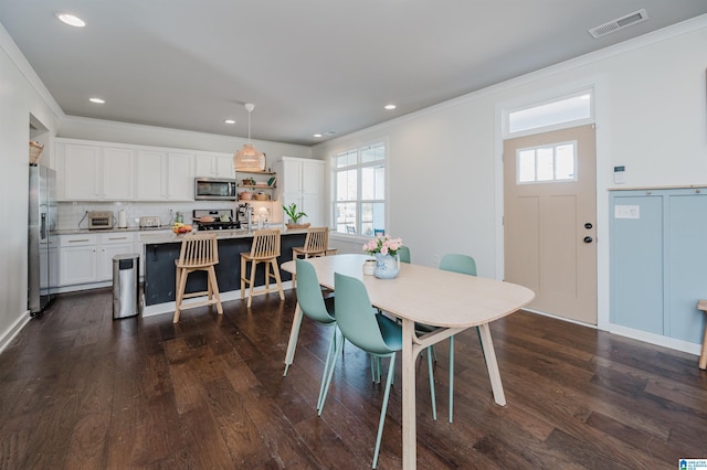 dining room featuring dark wood finished floors, visible vents, plenty of natural light, and recessed lighting