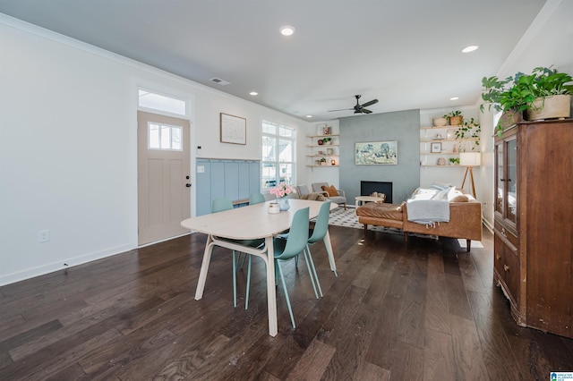 dining room with visible vents, ceiling fan, dark wood-style flooring, and crown molding