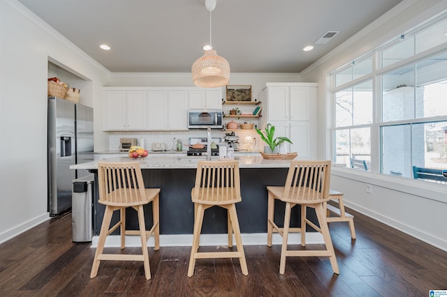 kitchen with visible vents, open shelves, backsplash, white cabinetry, and stainless steel appliances