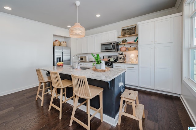 kitchen featuring a sink, open shelves, appliances with stainless steel finishes, and crown molding