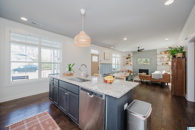 kitchen featuring a sink, light stone counters, stainless steel dishwasher, dark wood-style floors, and ceiling fan