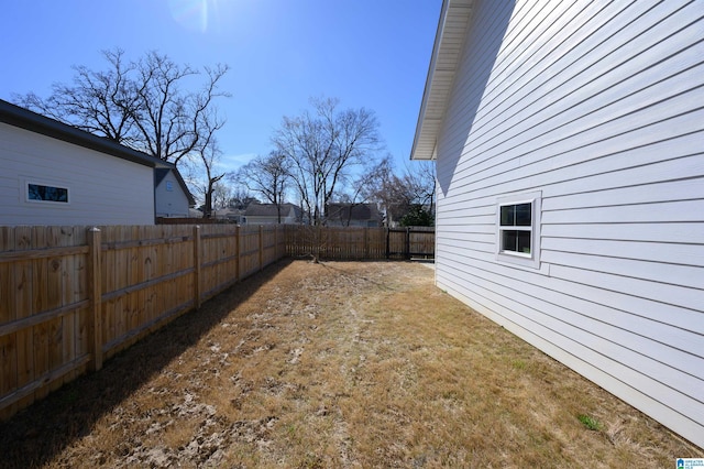 view of yard with a fenced backyard