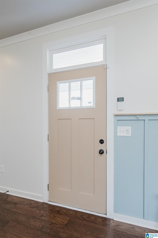 entryway with dark wood-style floors and baseboards