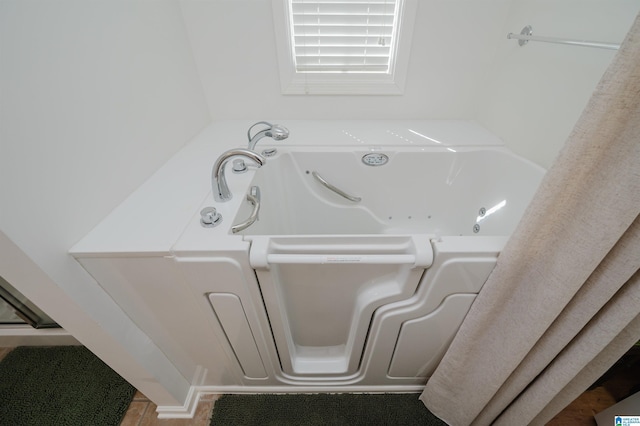 bathroom with a whirlpool tub