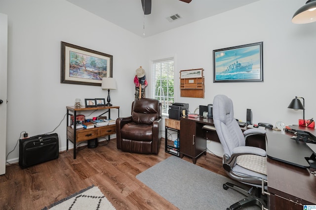 office featuring visible vents, wood finished floors, and a ceiling fan