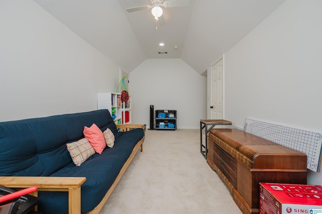 carpeted living area featuring visible vents, ceiling fan, and vaulted ceiling