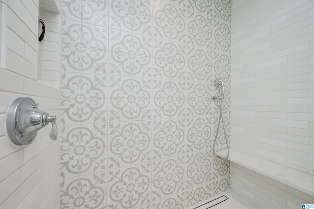 full bathroom with a tile shower