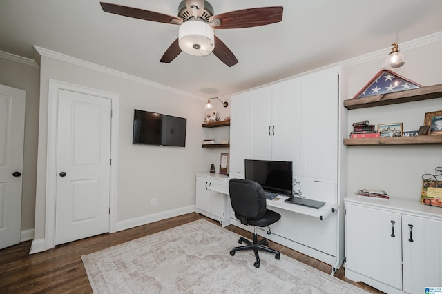 home office featuring dark wood-style flooring, baseboards, ceiling fan, and ornamental molding