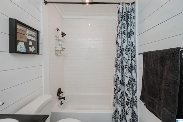 bathroom featuring shower / bath combination with curtain, toilet, and wood walls