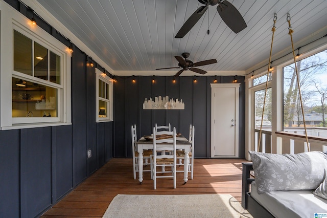 sunroom featuring wooden ceiling and ceiling fan