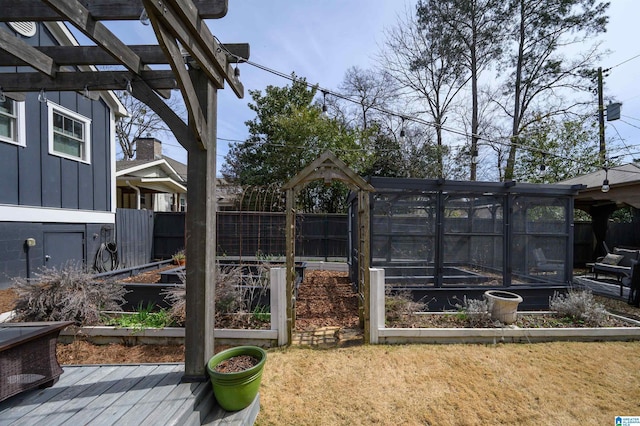 view of yard featuring a vegetable garden and fence