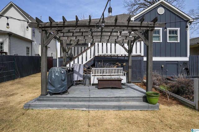 deck with stairway, a pergola, a yard, and fence