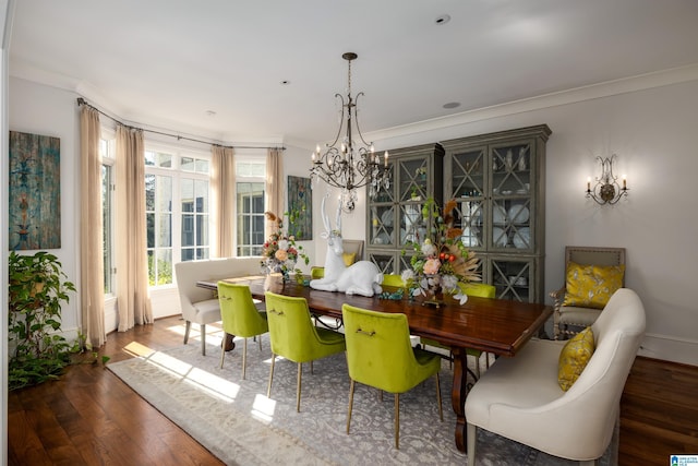 dining area with baseboards, an inviting chandelier, wood finished floors, and ornamental molding