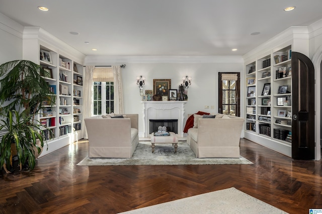 living area with built in shelves, a fireplace, recessed lighting, and ornamental molding