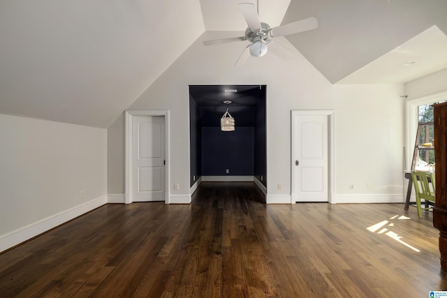 additional living space with ceiling fan, baseboards, lofted ceiling, and dark wood-style floors