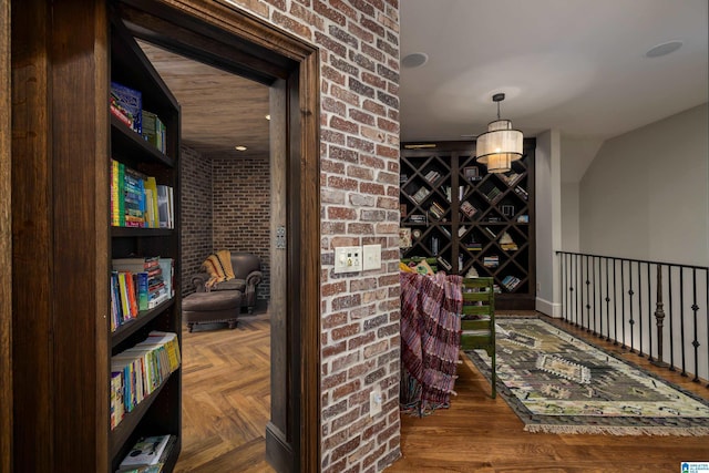 sitting room with brick wall and parquet floors