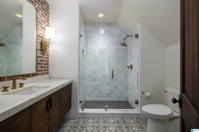 bathroom with tile patterned floors, toilet, a stall shower, vanity, and vaulted ceiling