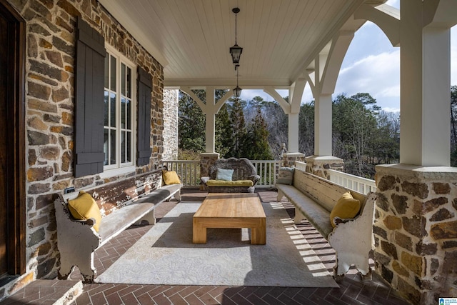 view of patio / terrace featuring covered porch and outdoor lounge area