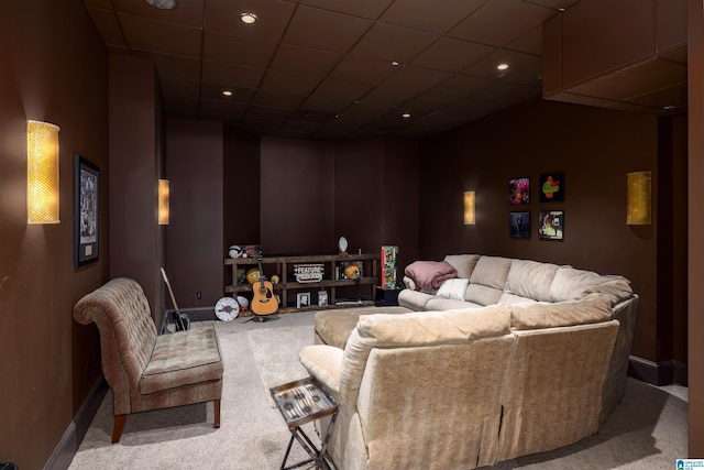 carpeted cinema with recessed lighting, baseboards, and a paneled ceiling