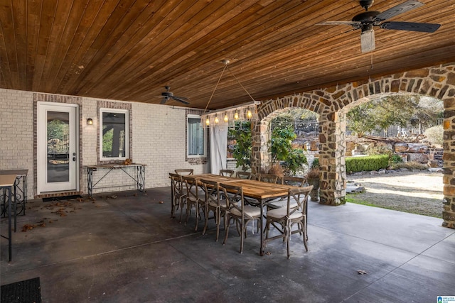 view of patio with outdoor dining area and ceiling fan