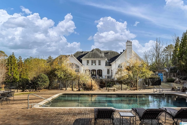 view of pool featuring a patio, fence, and a fenced in pool