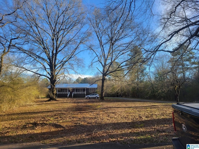 view of yard with covered porch