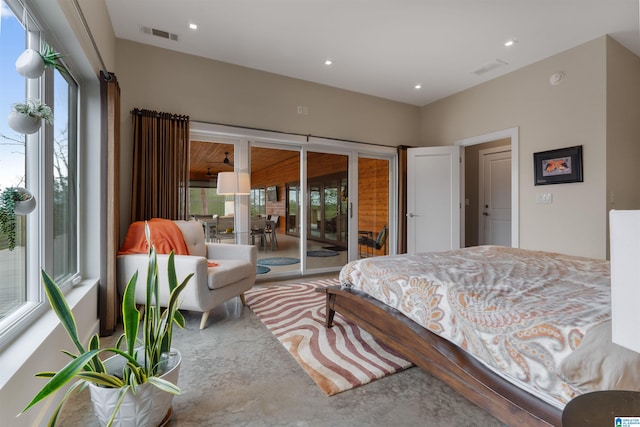 bedroom featuring access to outside, recessed lighting, visible vents, and concrete flooring