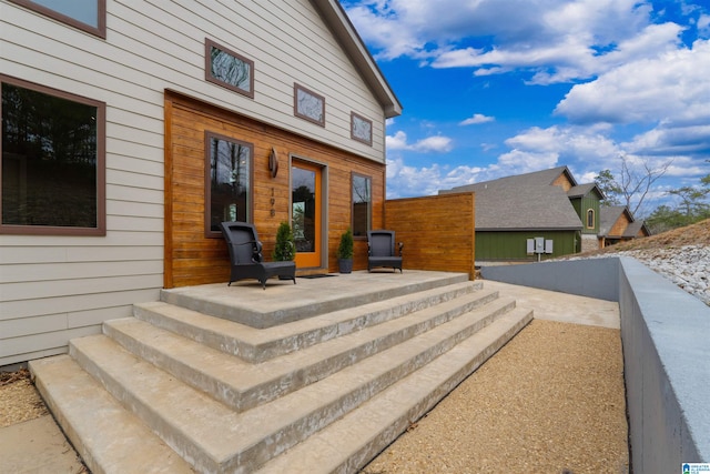 view of exterior entry with fence